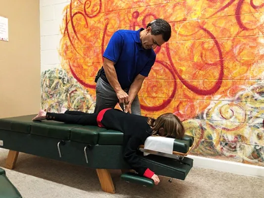 Chiropractor-Morgan-Hill-CA-Dave-Conragan-Using-Instrument-on-Child